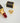 Регулируем пръстен от медицинска стомана със златисто покритие, панделка с релефна текстура и сърцевиден бял циркон поставен до червило