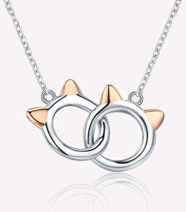 Сребърно колие с две преплетени котешки глави и Rose Gold детайли