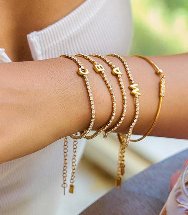 Гривна с буква R и циркони