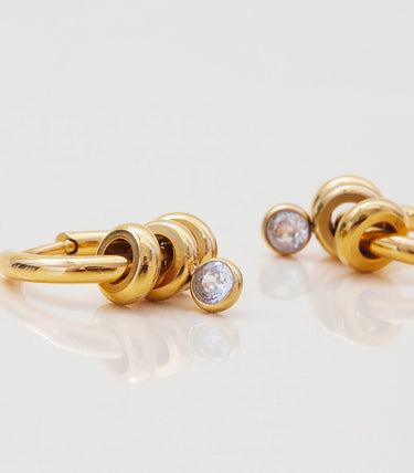 Обеци халки с рингове и бял циркон