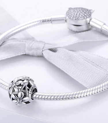 Сребърен талисман „Цветя на чистотата“